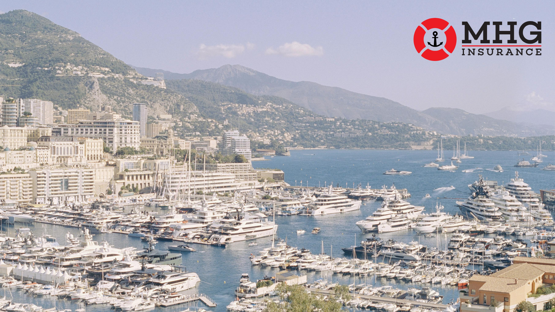 Luxury yachts docked in Monaco Harbor during an international boat show, showcasing superyachts, marina views, and coastal scenery — featured by MHG Insurance for global yacht and marine insurance insights.