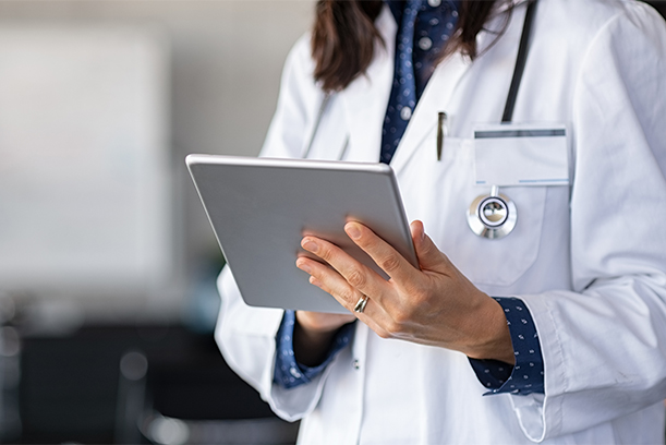 Doctor's office clerk explaining insurance benefits to customer, patient