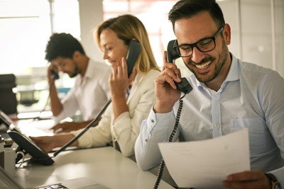 insurance brokers on the phone explaing benefits that aren't in the insurance contract