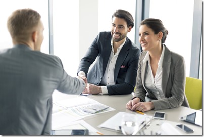 2 employees meeting with HR to discuss employee benefits