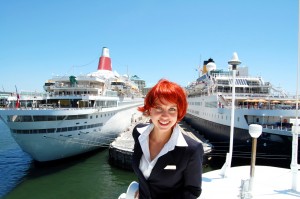 Woman standing in front of yachts