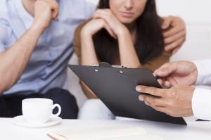 couple reviewing life insurance claim paperwork